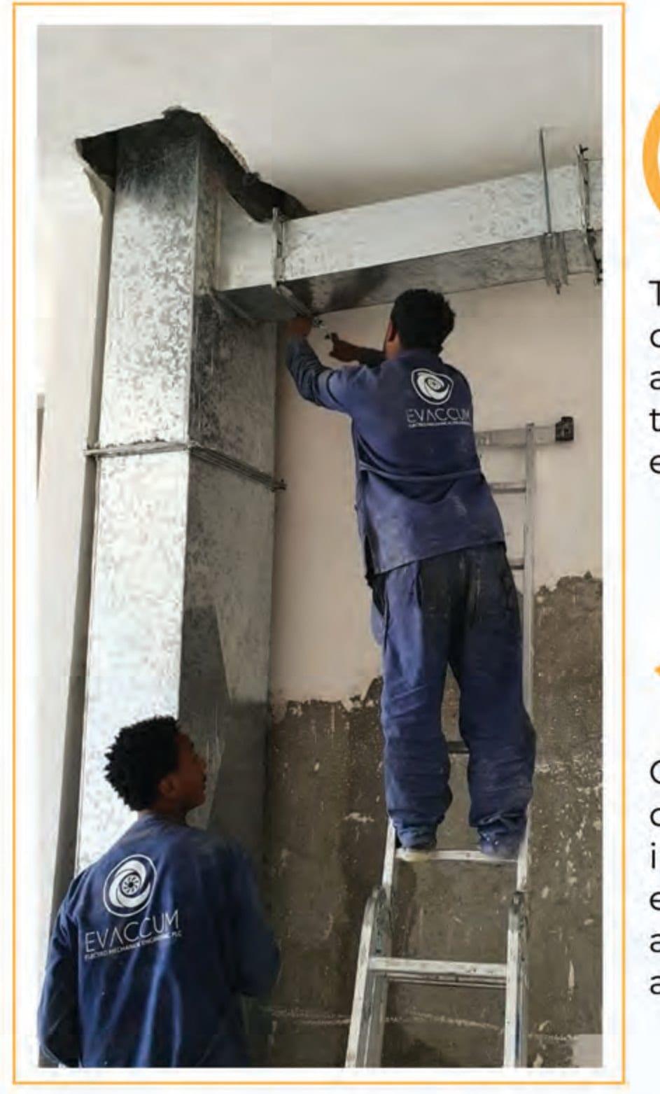 Evaccum engineer installing ductwork